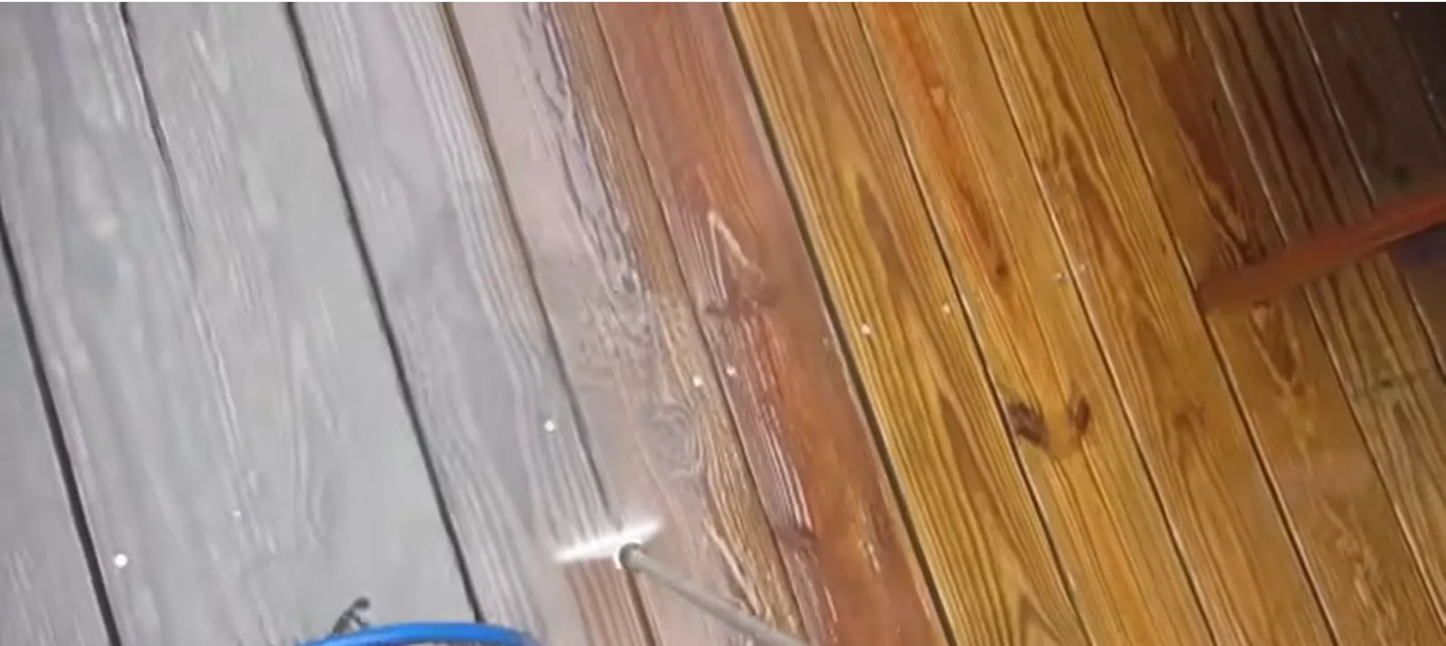 Doncaster wooden decking and fence after professional pressure washing, showing clean, vibrant timber free of moss and dirt.