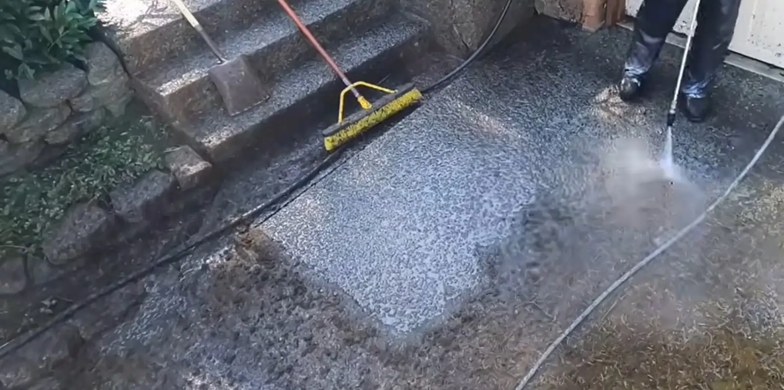 Happy Doncaster homeowner enjoying a freshly pressure-washed driveway and garden.